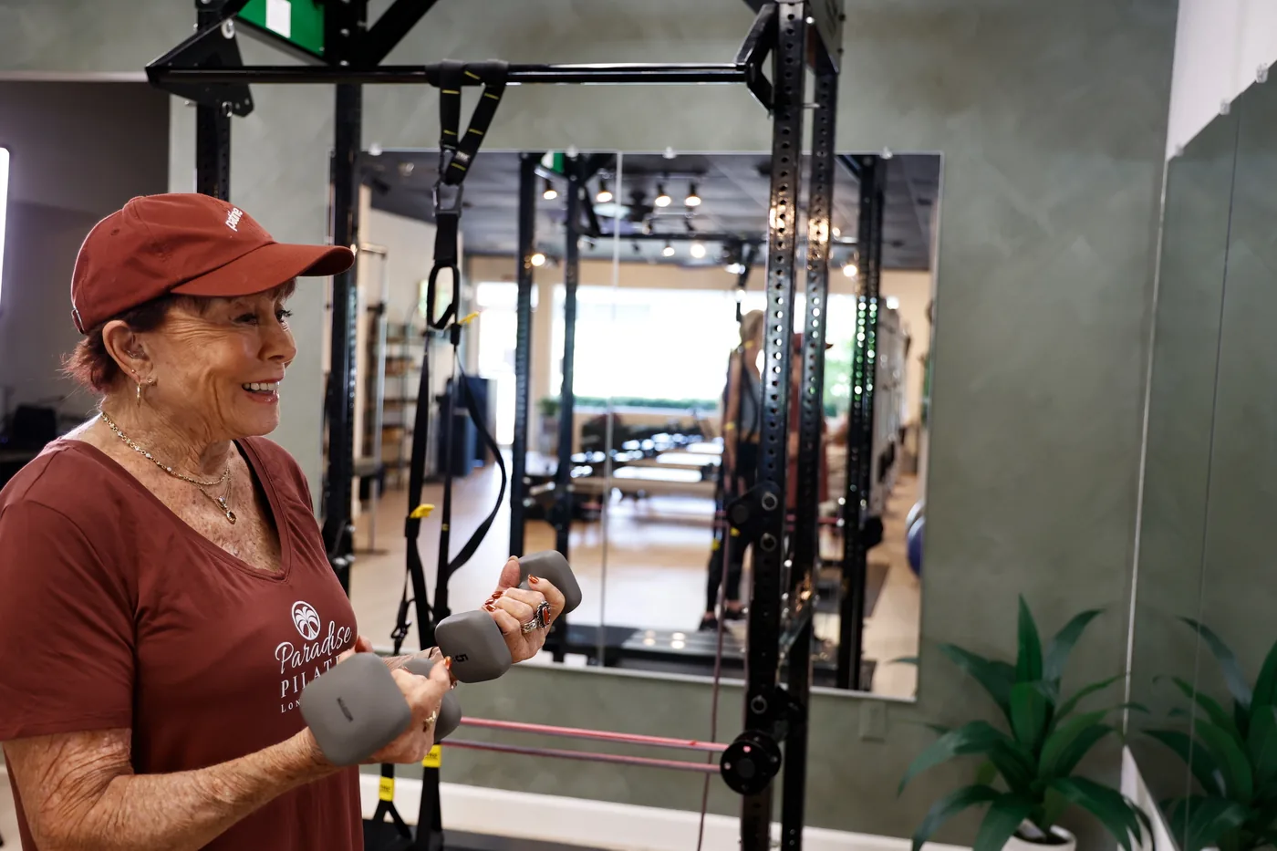 Older adult working with Pilates equipment