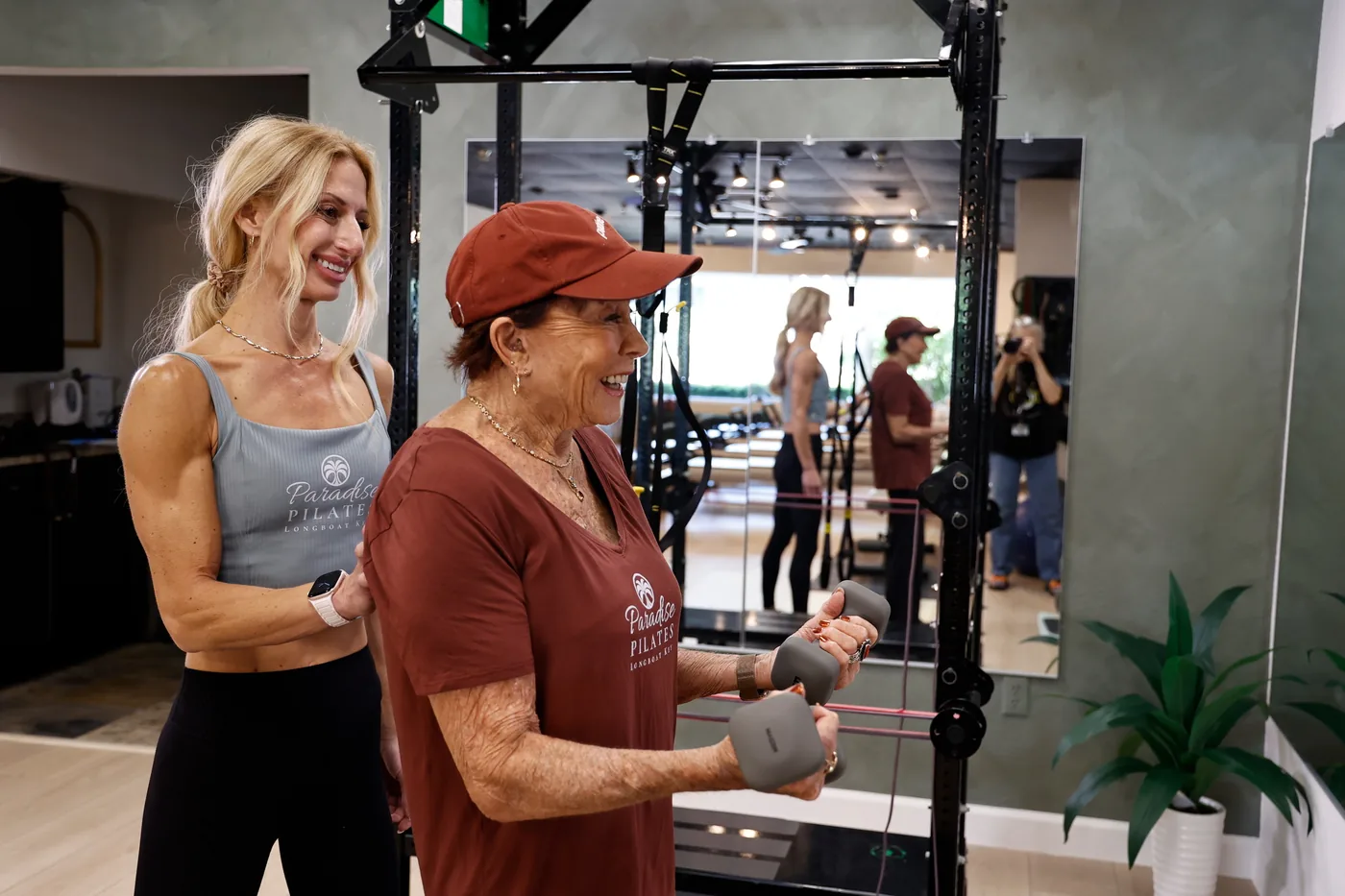 Pilates instructor assisting a client